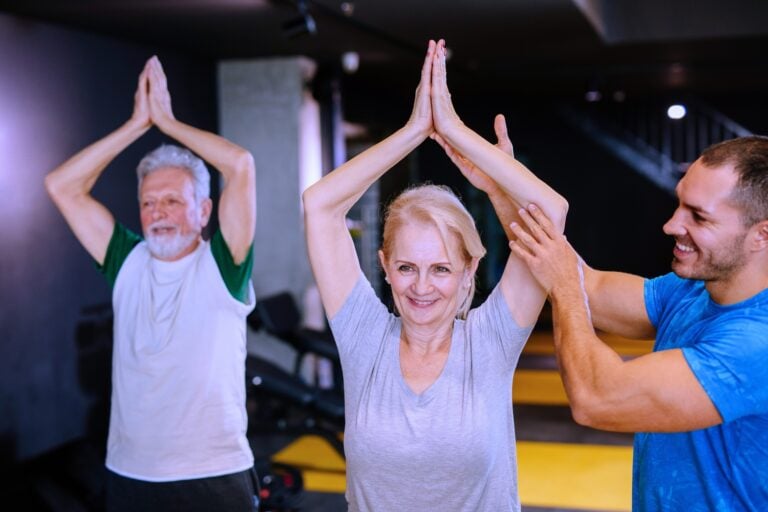 Group of adults’ mid-movement in a FlowFusion class at Active Fitness Medowie