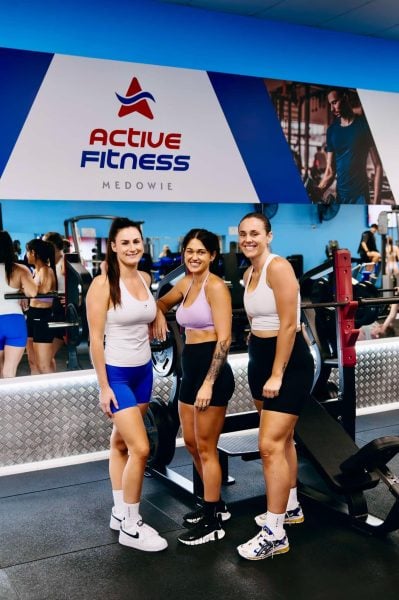 Group of smiling women with their trainer Millie at Active Fitness Medowie celebrating fitness