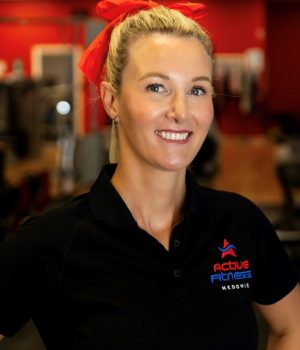 Portrait of Liz, a friendly fitness instructor at Active Fitness Medowie, smiling and wearing fitness gear.
